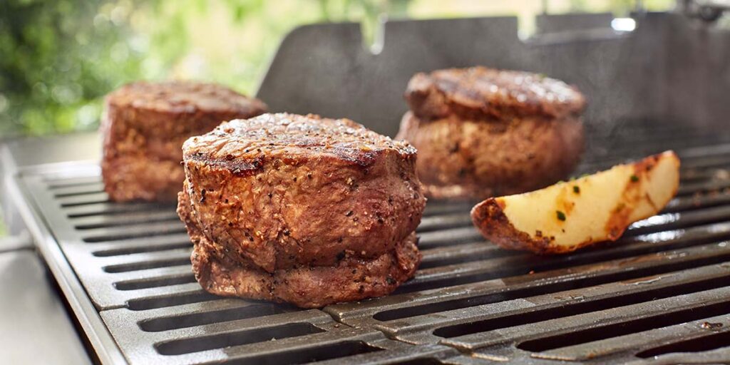 Steak & Potatoes Cooking on a BBQ