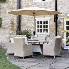 Bramblecrest Chedworth 6 Seat Garden Dining Set in Sandstone with Round Table, Lazy Susan, Parasol &amp; Base image 0
