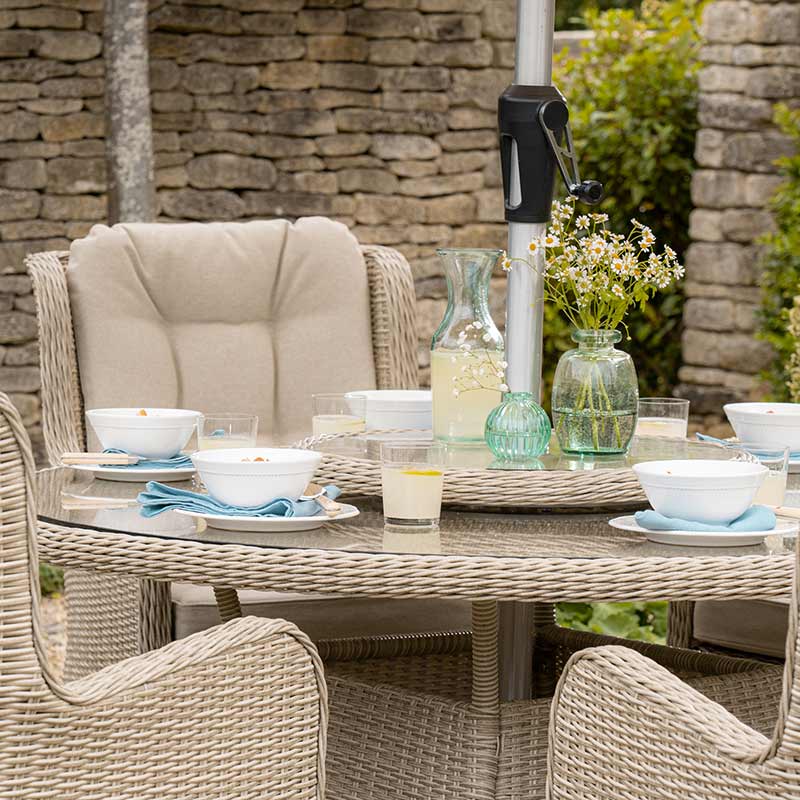 Bramblecrest Chedworth 6 Seat Garden Dining Set in Sandstone with Round Table, Lazy Susan, Parasol &amp; Base image 0