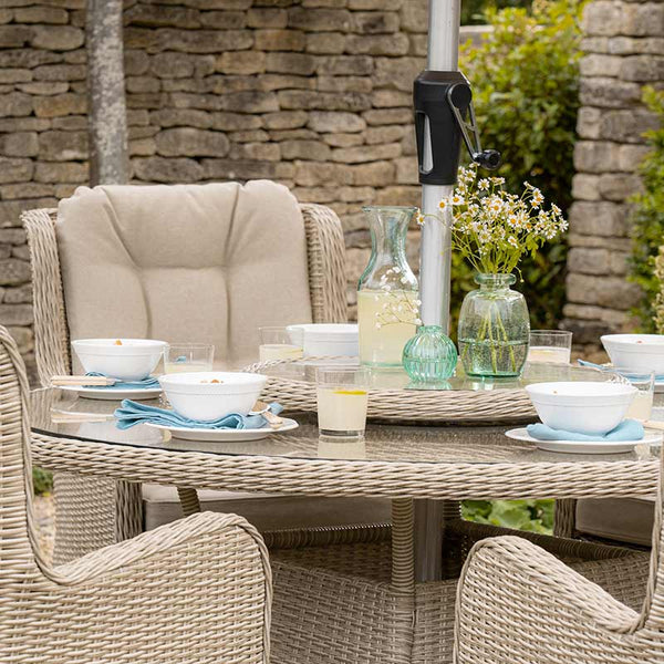 Bramblecrest Chedworth 6 Seat Garden Dining Set in Sandstone with Round Table, Lazy Susan, Parasol &amp; Base image 1