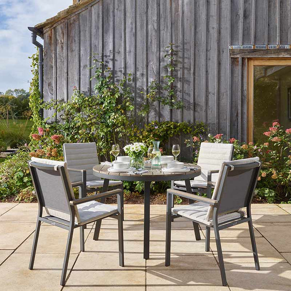 Bramblecrest Zurich 4 Seat Round Patio Dining Set with Parasol & Base image 1