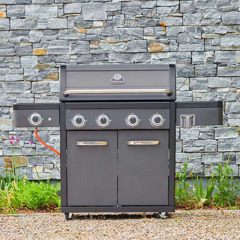 Gray Grillstream barbecue grill with brand logo against a stone wall background