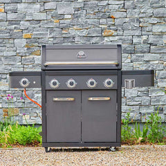 Gray Grillstream barbecue grill with brand logo against a stone wall background