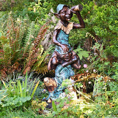 Home and Garden Pixie on shoulders garden statue with an aged green, gold and bronze paint finish.