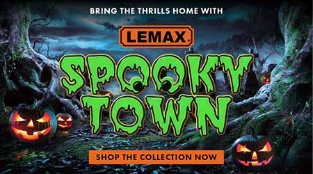 A Halloween-themed promotional banner with the text 'BRING THE THRILLS HOME WITH SPOKY TOWN' in large green letters, 'SHOP THE COLLECTION NOW' in orange, and 'LEMAX' at the top. The background shows spooky haunted-house imagery including a dark house, bats, and a full moon, flanked by carved jack-o'-lantern faces on both sides.