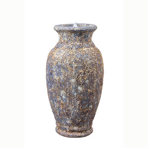 A rustic Altico Milani Rustic Grey ceramic water feature that has a heat-treated aged and textured appearance with mottled gray, brown, and beige tones, shown against a plain white background.