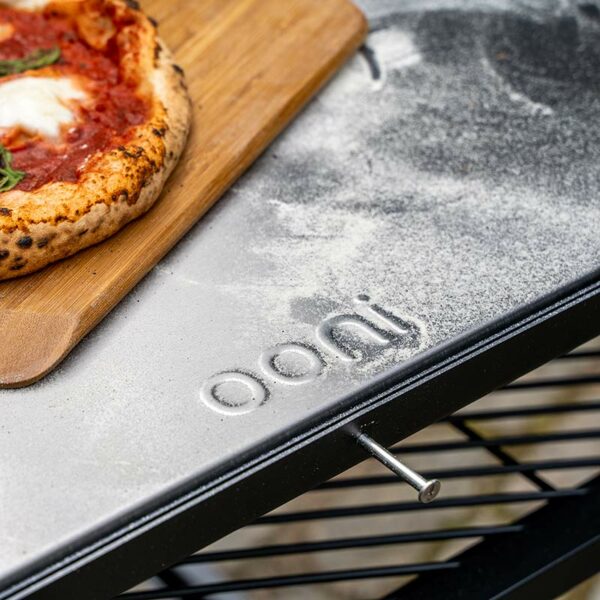 Serving pizza on the Ooni Modular Table