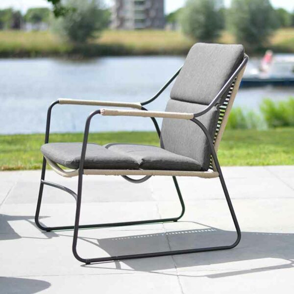 4 Seasons Outdoor Scandic Living Chair with cushions on patio