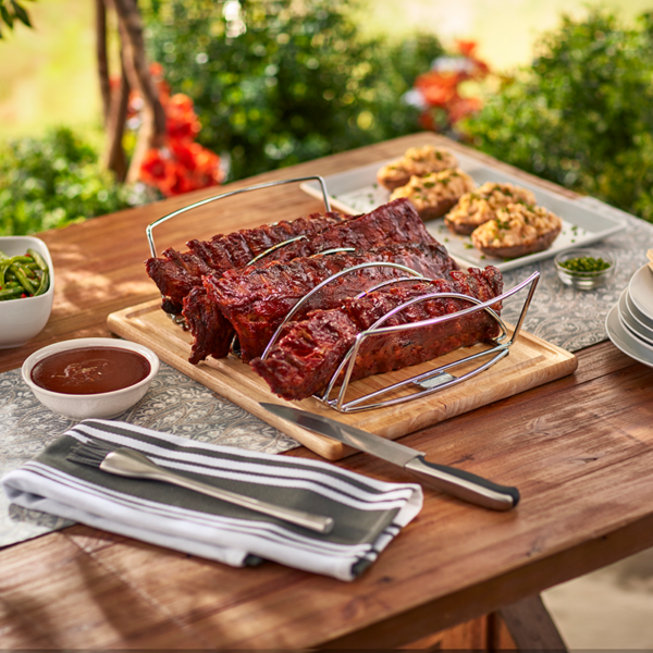 Use the Weber Barbecue Premium 2-in-1 Grilling Rack (Reversible) #6469 to prepare a delicious rack of ribs
