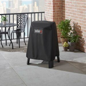 The Weber Premium Cover for Lumin/Lumin Compact with Stand on terrace