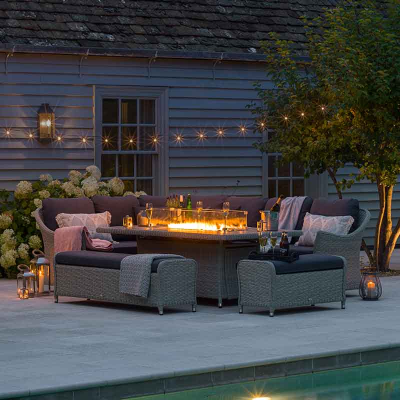 Bramblecrest Monterey Modular Sofa Set with Large Rectangular Firepit Table in Dove Grey at night