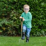 Child using the Kent & Stowe Kids Stainless Steel Digging Fork