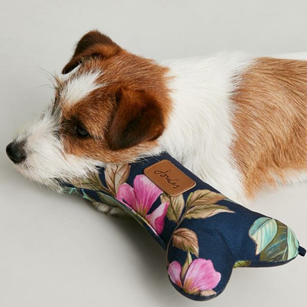 Joules Botanical Floral Comfort Bone Dog Toy lifestyle with dog