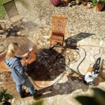 Stihl RE 100 Pressure Washer cleans garden furniture
