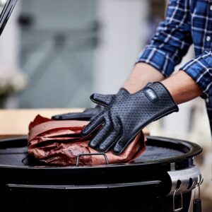 Weber Silicone Barbecuing Gloves placing wrapped meat on barbecue