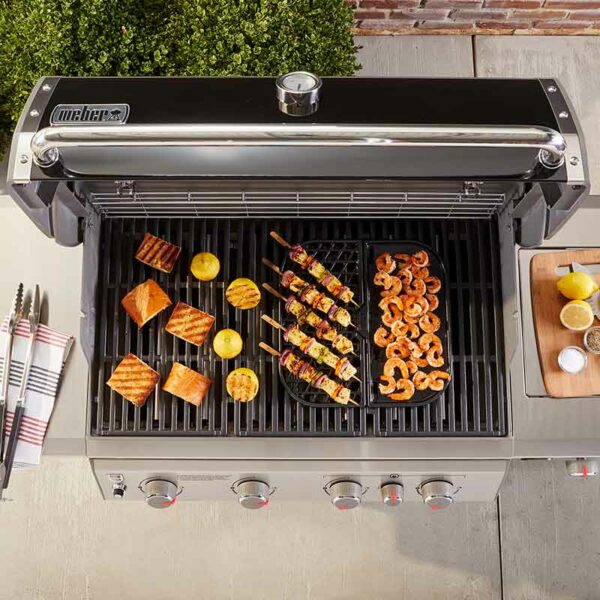The Weber Gourmet BBQ System (GBS) Grill & Griddle Station in use