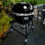 The Weber Summit Kamado E6 Charcoal Grill Barbecue in garden