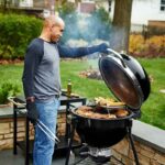 The Weber Summit Kamado E6 Charcoal Grill Barbecue in use