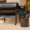 mood image of Weber Grill Academy Blend All-Natural Hardwood Pellets next to SmokeFire EPX6