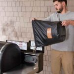 Wood pellets pour in easily with the Weber Fuel Storage Bag