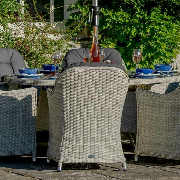 Bramblecrest Monterey Dove Grey 6 Seat Elliptical Dining Set with parasol and base
