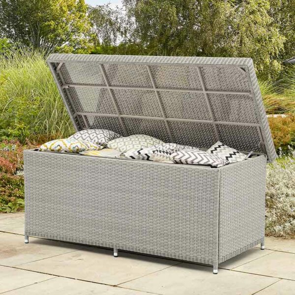 Bramblecrest Wentworth Large Cushion Storage Box with Liner in Pewter Rattan in garden shown open with scatters