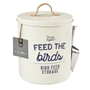 A Burgon & Ball 'Feed the Birds' Bird Food Tin. The tin is white stone coloured with blue typography. The included scoop is visible on the side.