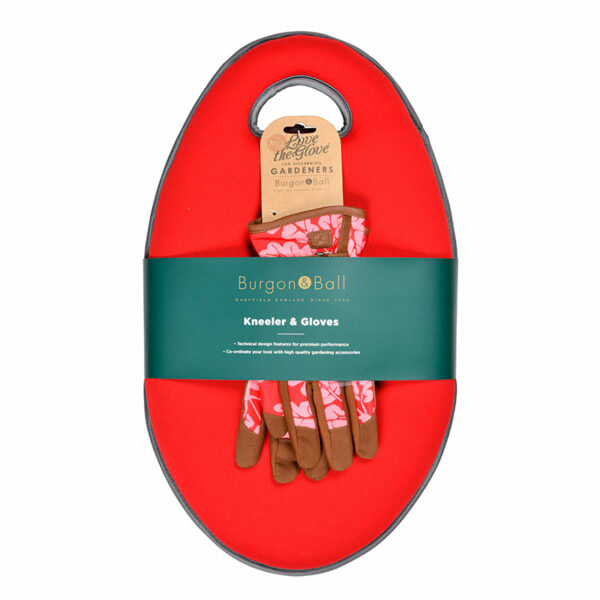 A pair of red oak patterned leather gardening gloves on top of a red oval garden kneeler with an integrated handle, all wrapped in a packaging sleeve.