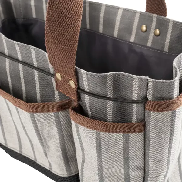 A side view of the grey Burgon & Ball Sophie Conran Tool Bag highlighting the side pockets.