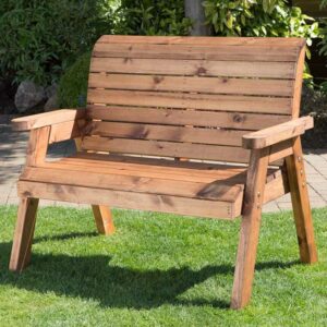 A Charles Taylor Traditional 2 Seat Bench in garden