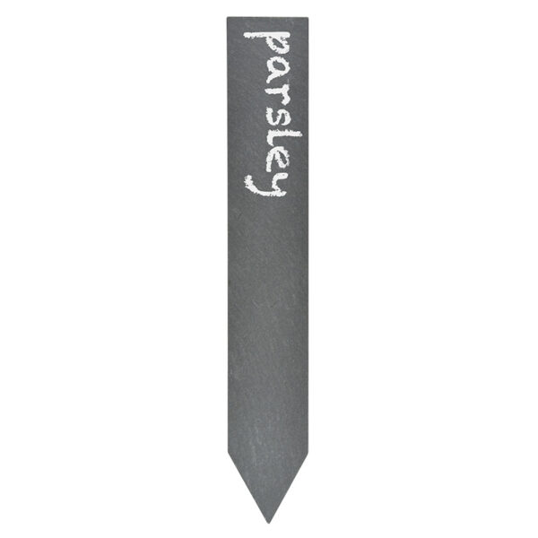 A single slate plant marker with an angled point on one end for pushing into the ground with parsley written on it with white wax.
