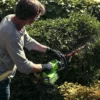 Greenworks 40V 61cm hedge Trimmer with 2Ah Battery & Charger man cutting