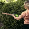 Greenworks 40V 61cm hedge Trimmer with 2Ah Battery & Charger woman holding