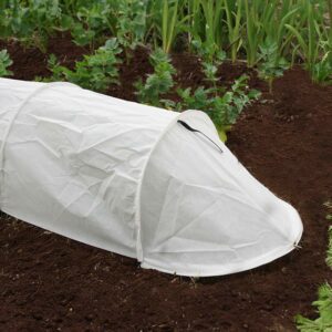 A white, fleece tunnel, placed over a row of plants in a veg bed.