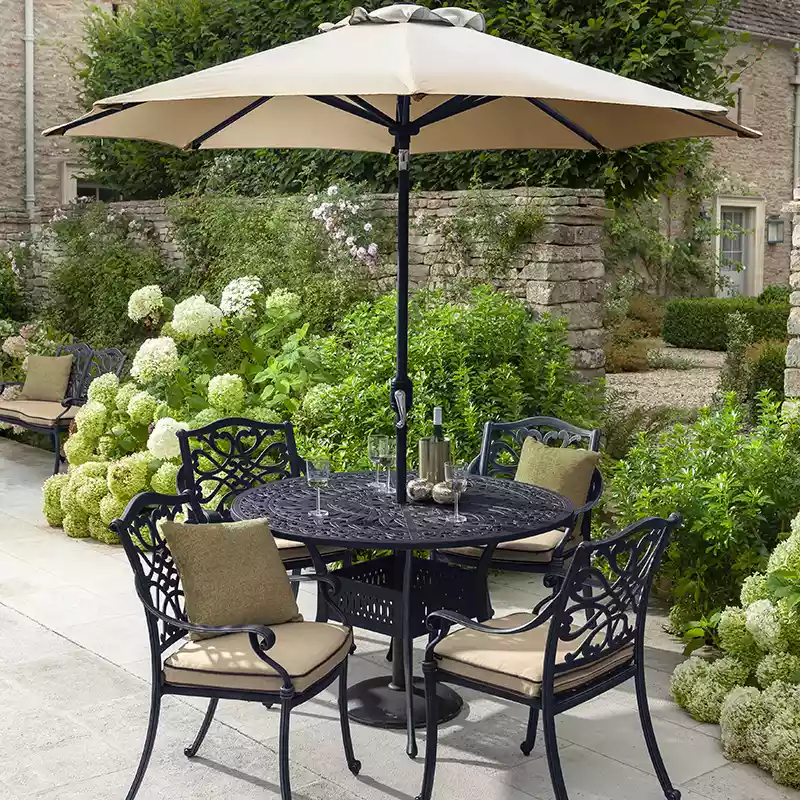 https://www.gatesgardencentre.co.uk/wp-content/uploads/hartman-capri-bronze-4-seat-round-dining-set-with-parasol-base.webp