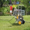 hozelock assembled metal hose cart (90m) filled in garden