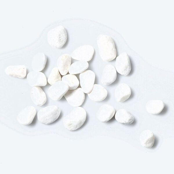 A cluster of scattered white quartz pot topper stones. The stones are smooth and rounded, between 15 and 35mm.