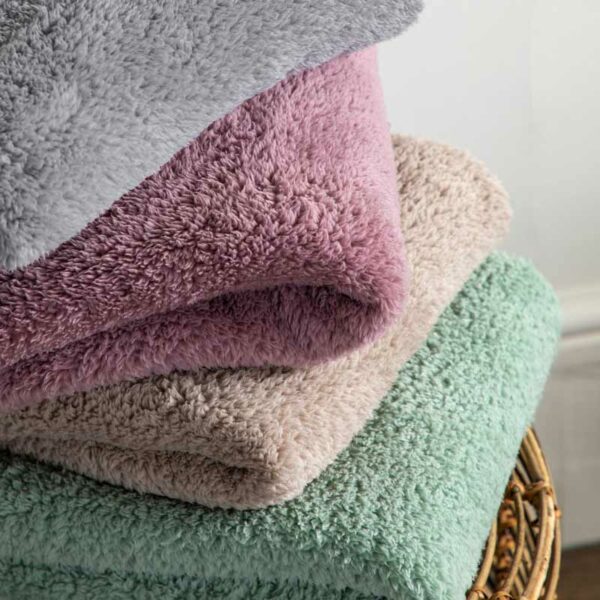 A pile of super-soft luxurious blankets from Kilburn & Scott