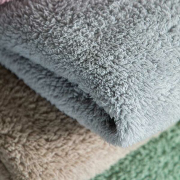 A pile of super-soft luxurious blankets from Kilburn & Scott