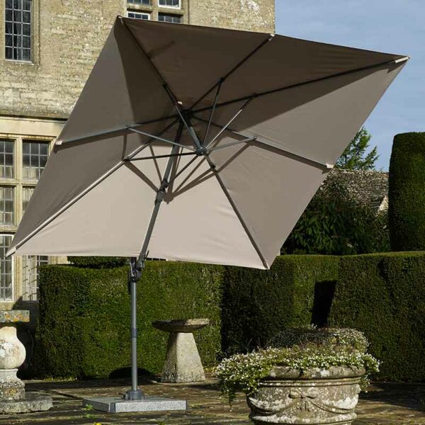 Bramblecrest Lichfield 2.7 x 2.7 m Square Cantilever Parasol in Sand tilting up to provide shade