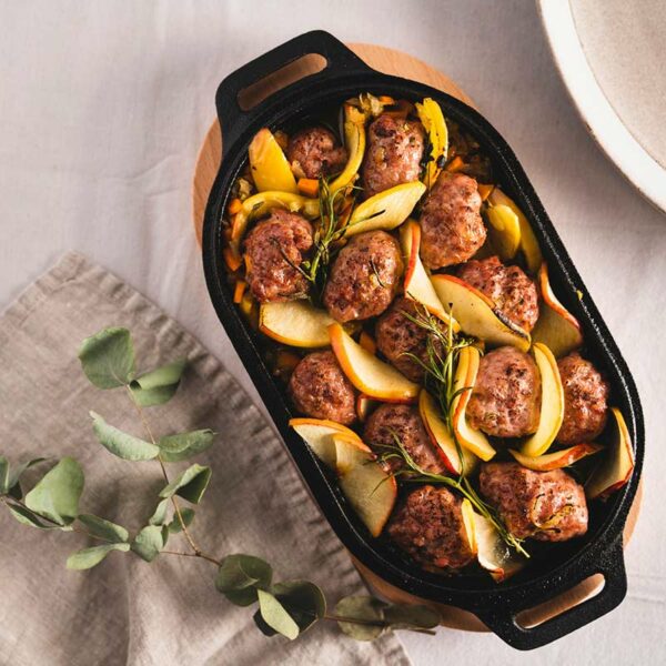 Ooni Cast Iron Sizzler Pan in use with meatballs