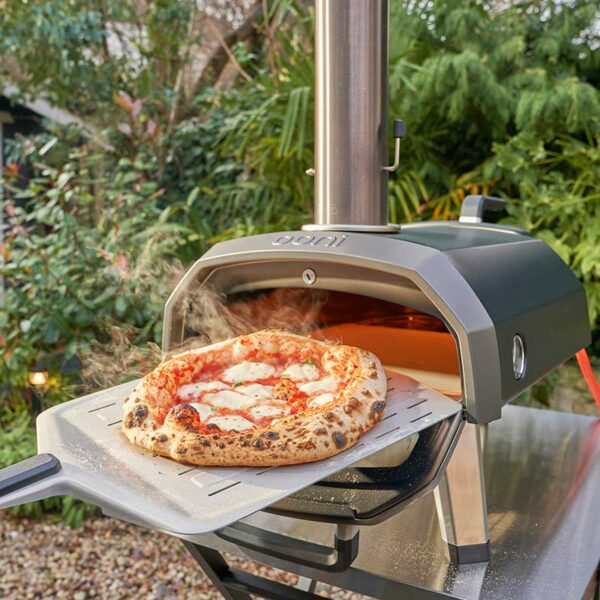 Ooni Karu 12G Pizza Oven in use with pizza