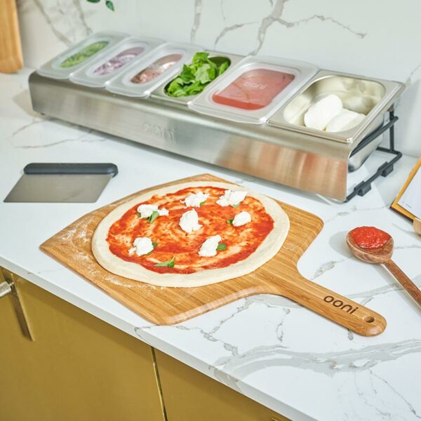 Ooni Pizza Topping Station in use in kitchen