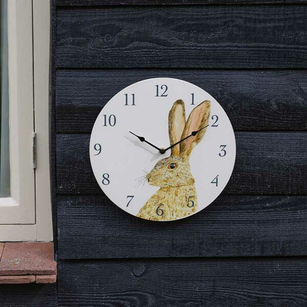 The Outside In 12-Inch Hare Wall Clock in situ outdoors
