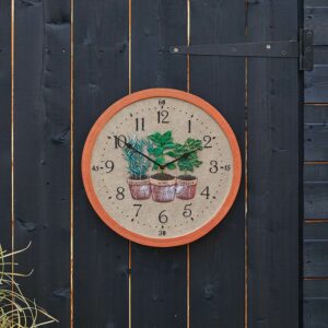 The Outside In 12-Inch Herbs Wall Clock and Thermometer in situ outdoors