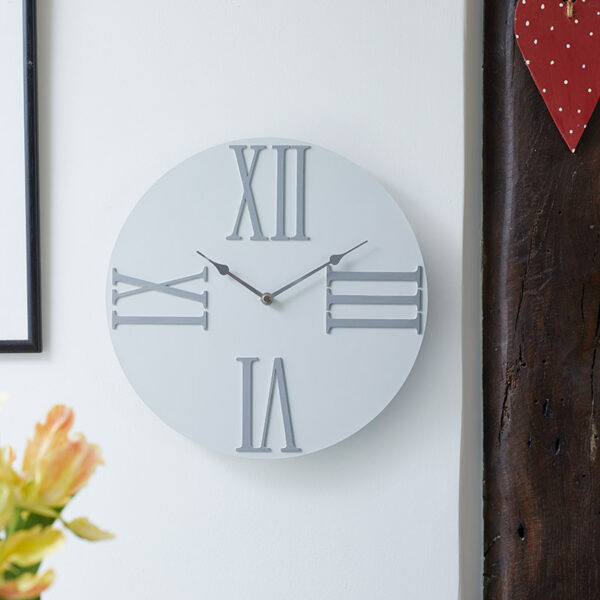 The Outside In Moda Cream Wall Clock in situ indoors on white wall