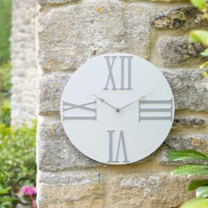 The Outside In Moda Cream Wall Clock in situ outdoors