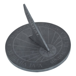 A round slate sundial angled diagonally. The dial is uniformly round with a diagonally upright pointer.