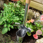 Use the The Kent & Stowe Stainless Steel Long Bulb Planter in beds and borders