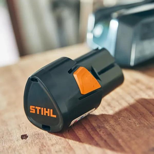 STIHL AS 2 Battery next to charger